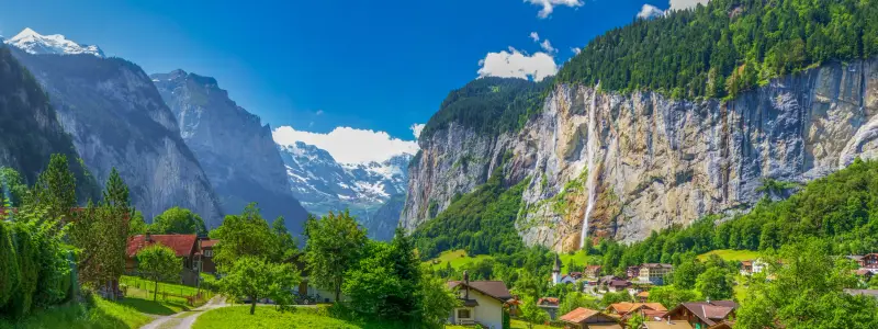 Famous Lauterbrunnen valley with gorgeous waterfall and Swiss Alps in the background, Berner Oberland, Switzerland, Europe.
